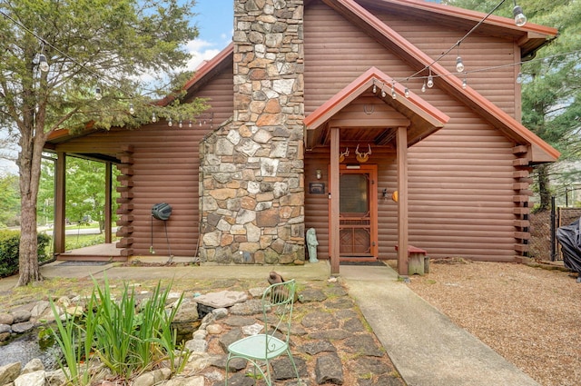 121 Waverly St, Hollister, MO 65672 - log home featuring log siding and a chimney