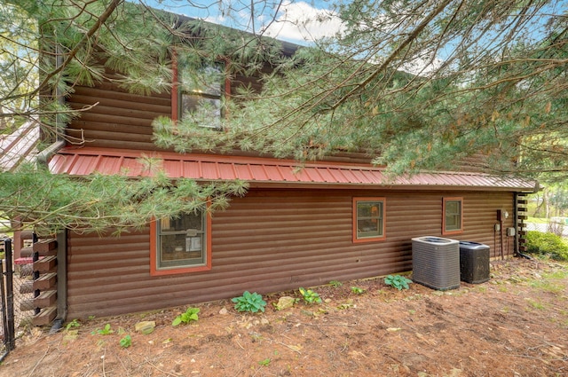 121 Waverly St, Hollister, MO 65672 - view of side of home featuring central AC unit and metal roof
