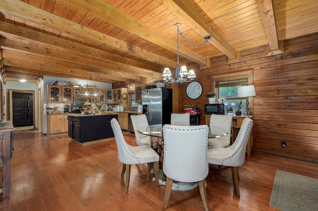 121 Waverly St, Hollister, MO 65672 - dining room featuring an inviting chandelier, dark wood-style flooring, beam ceiling, and wood ceiling