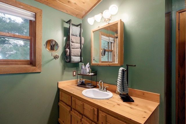 121 Waverly St, Hollister, MO 65672 - bathroom with vaulted ceiling, wood ceiling, and vanity