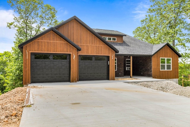 1238 Emory Creek Blvd, Branson, MO 65616 - view of front of house featuring concrete driveway, an attached garage, and a shingled roof