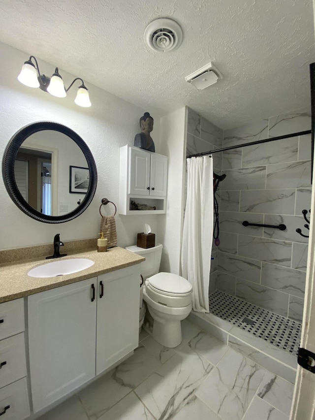 bathroom with visible vents, a shower stall, vanity, toilet, and marble finish floor