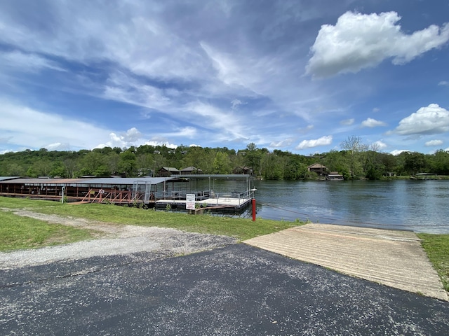 110 Wilshire Dr Unit 12, Hollister, MO 65672 - dock area with a water view and a forest view