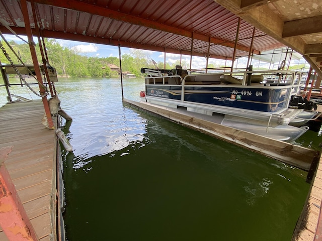 110 Wilshire Dr Unit 12, Hollister, MO 65672 - dock area featuring boat lift and a water view