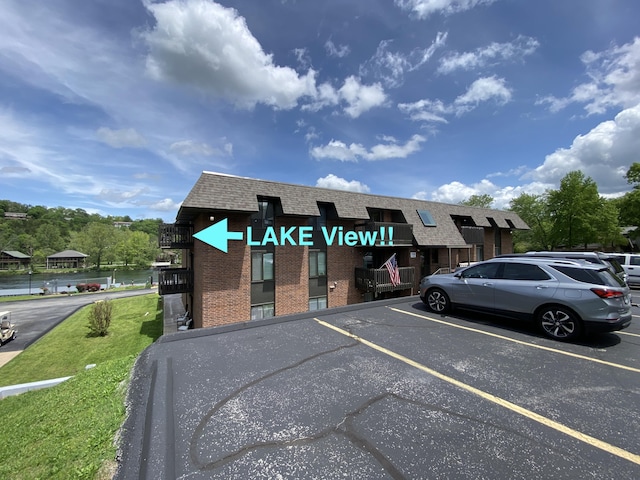 110 Wilshire Dr Unit 12, Hollister, MO 65672 - view of uncovered parking lot