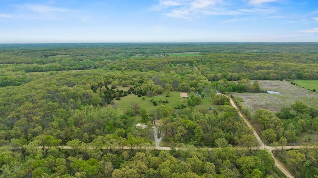 bird's eye view featuring a forest view and a rural view