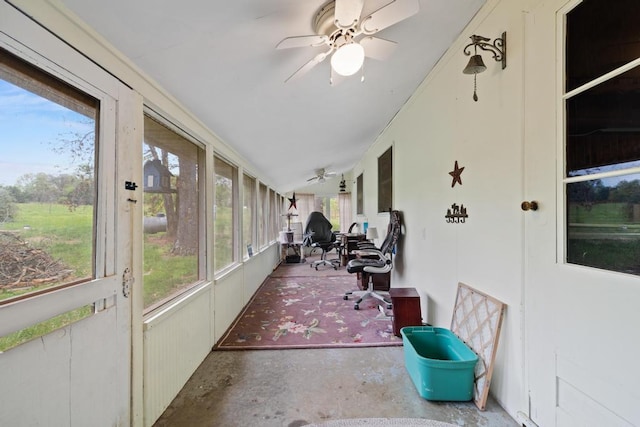 sunroom featuring ceiling fan