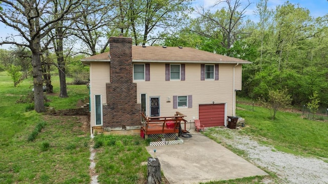 back of house with a lawn and a chimney