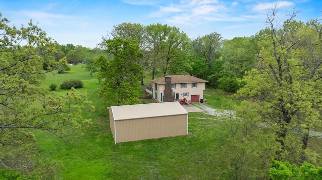 bird's eye view featuring a wooded view