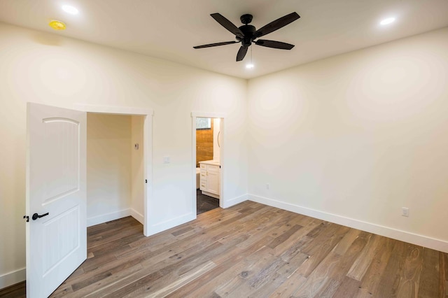 unfurnished bedroom featuring recessed lighting, baseboards, and light wood-type flooring
