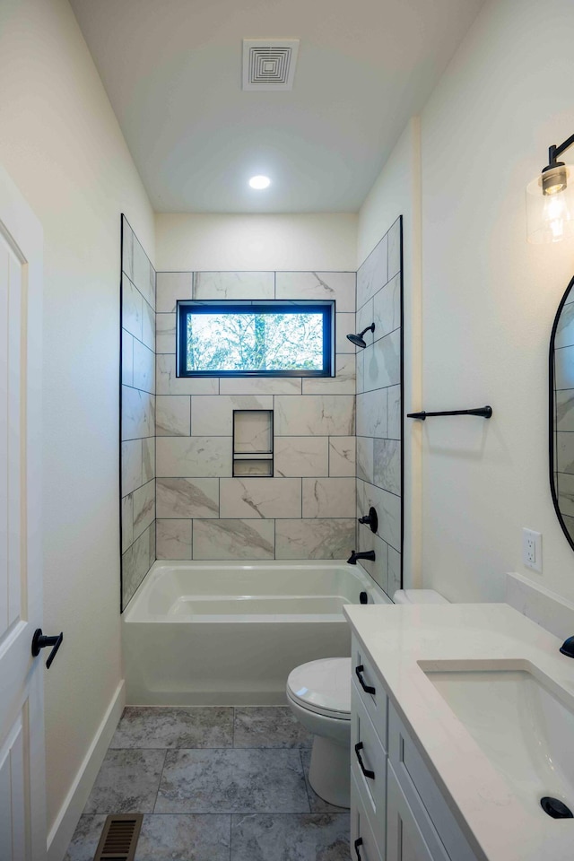 bathroom with visible vents,  shower combination, and toilet