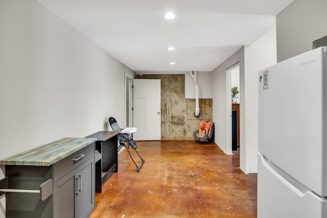 office space featuring finished concrete floors and recessed lighting