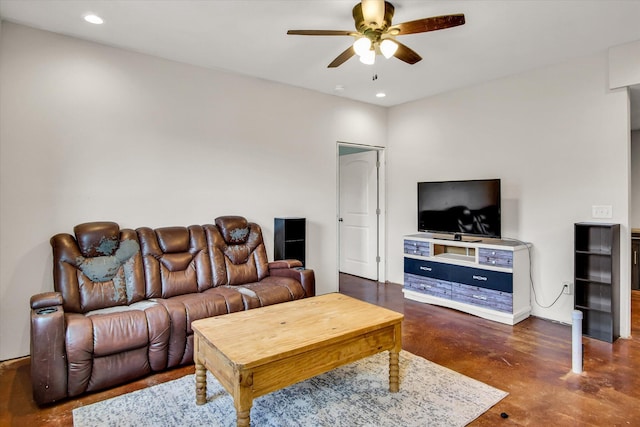 living room featuring finished concrete floors, a ceiling fan, and recessed lighting