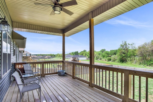wooden deck featuring a ceiling fan