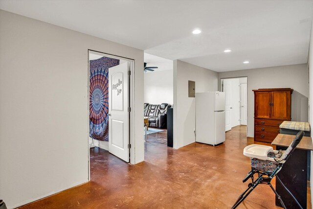 sitting room featuring recessed lighting, a ceiling fan, and finished concrete flooring