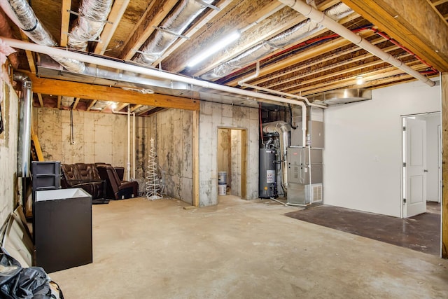 unfinished basement featuring heating unit and water heater