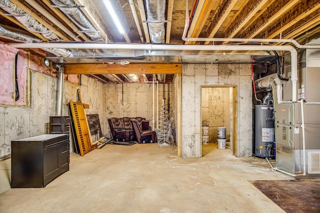 unfinished below grade area featuring heating unit and water heater