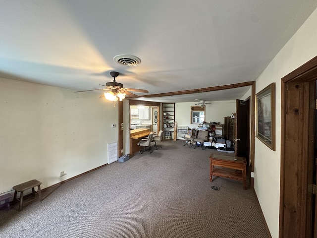 interior space with carpet floors, ceiling fan, and visible vents