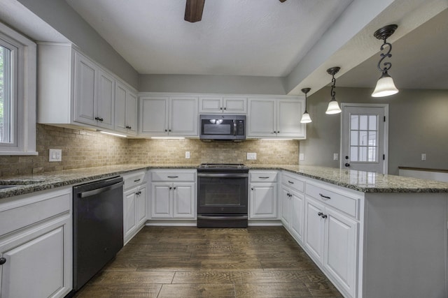 kitchen featuring a peninsula, dishwashing machine, stainless steel microwave, white cabinets, and black range with electric stovetop