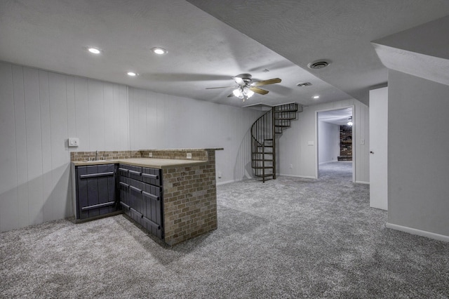 bar with a sink, ceiling fan, stairway, a bar, and carpet flooring