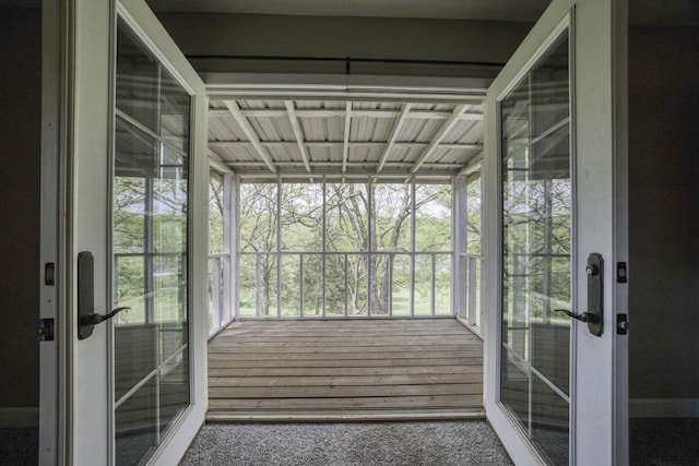 unfurnished sunroom featuring french doors