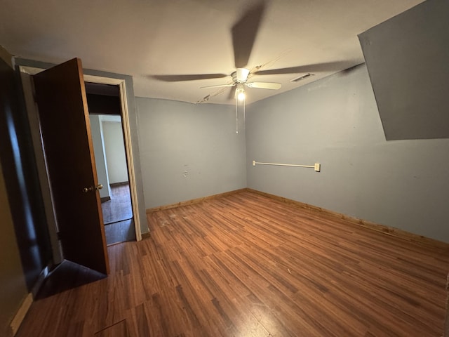 unfurnished bedroom with visible vents, baseboards, ceiling fan, and wood finished floors
