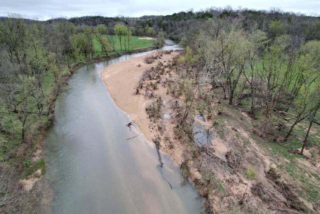 bird's eye view featuring a wooded view
