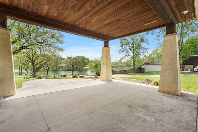 view of patio with a water view
