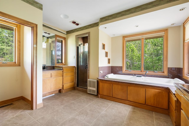 full bathroom featuring a bath, visible vents, a shower stall, vanity, and tile patterned floors