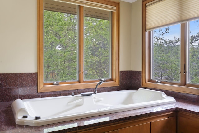 full bath featuring a tub to relax in