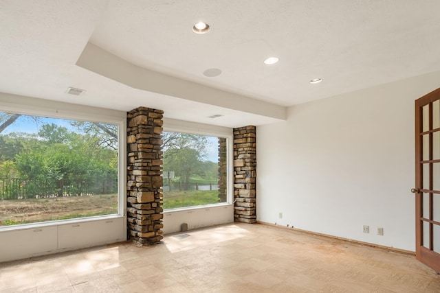 empty room featuring recessed lighting, tile patterned floors, and visible vents