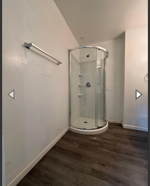 1207 W Florida St, Springfield, MO 65803 - full bath with baseboards, a stall shower, and wood finished floors