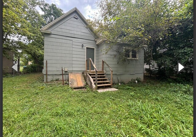 1207 W Florida St, Springfield, MO 65803 - back of house featuring a yard