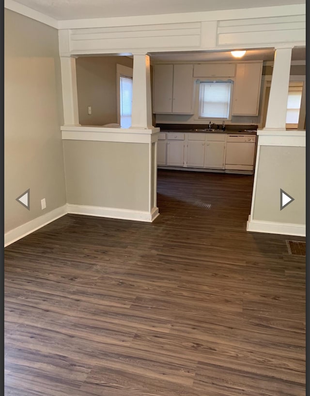 837 S Nettleton Ave, Springfield, MO 65806 - interior space featuring baseboards, dark wood-type flooring, and a healthy amount of sunlight