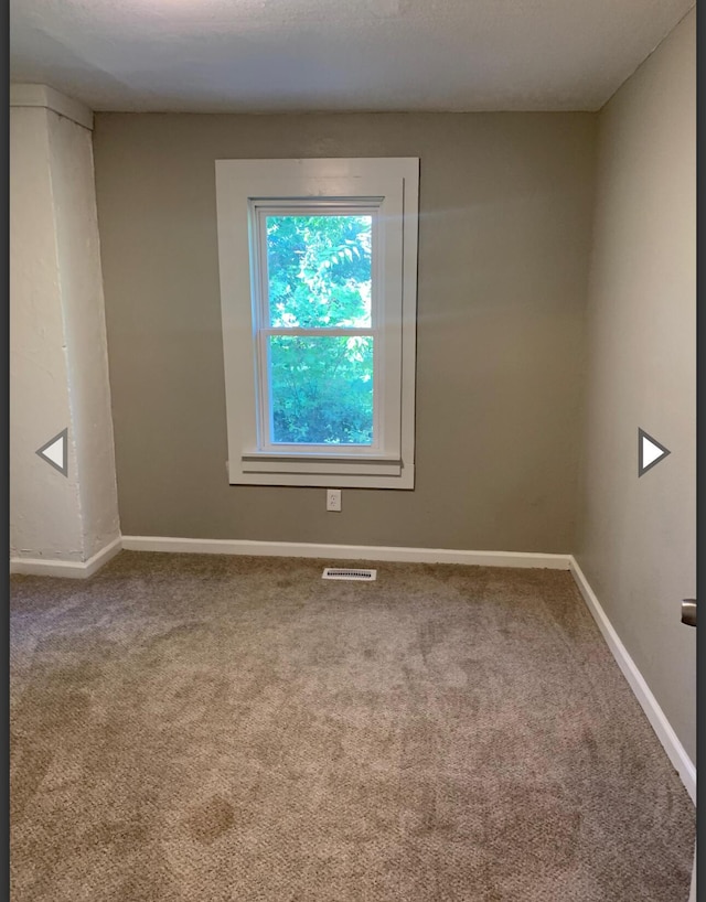 837 S Nettleton Ave, Springfield, MO 65806 - unfurnished room featuring baseboards, carpet flooring, and visible vents