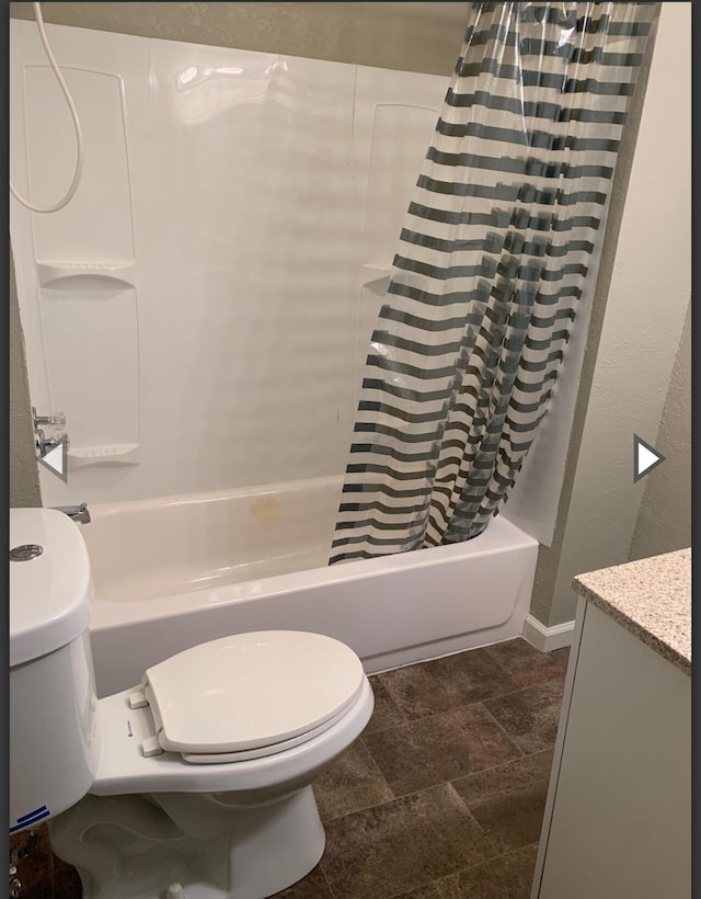 837 S Nettleton Ave, Springfield, MO 65806 - full bath with baseboards, shower / bathtub combination with curtain, toilet, and stone finish flooring