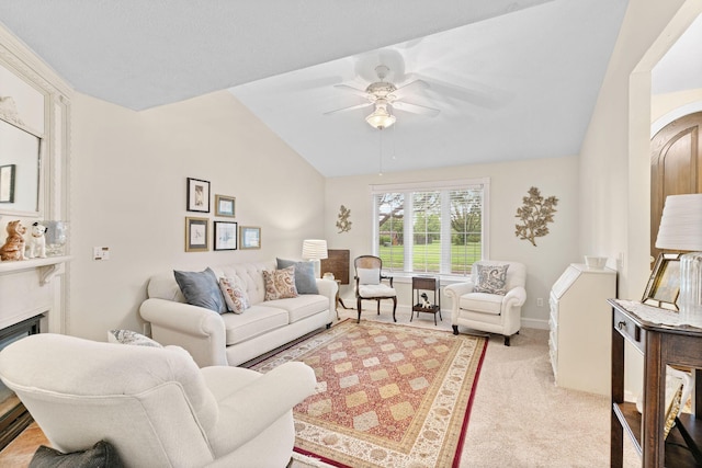 living room featuring ceiling fan, arched walkways, a fireplace, lofted ceiling, and light carpet