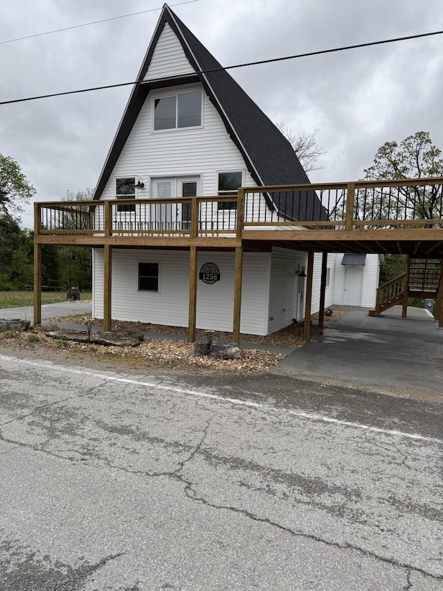 1256 Black Oak Resort Ln, Lampe, MO 65681 - exterior space featuring a carport and a deck