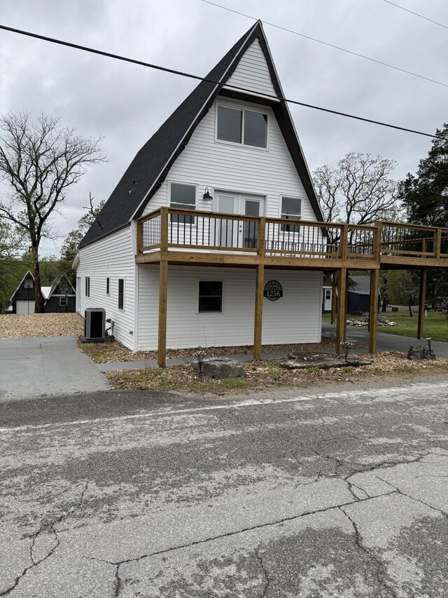 1256 Black Oak Resort Ln, Lampe, MO 65681 - exterior space featuring central AC unit and a deck