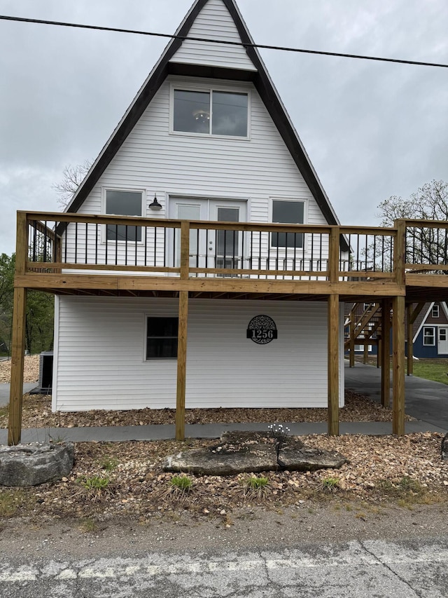 1256 Black Oak Resort Ln, Lampe, MO 65681 - exterior space featuring central air condition unit and a deck