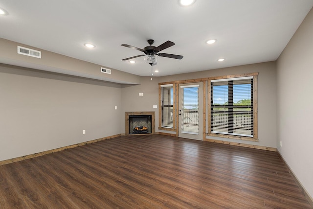 unfurnished living room with ceiling fan, a fireplace, recessed lighting, wood finished floors, and visible vents