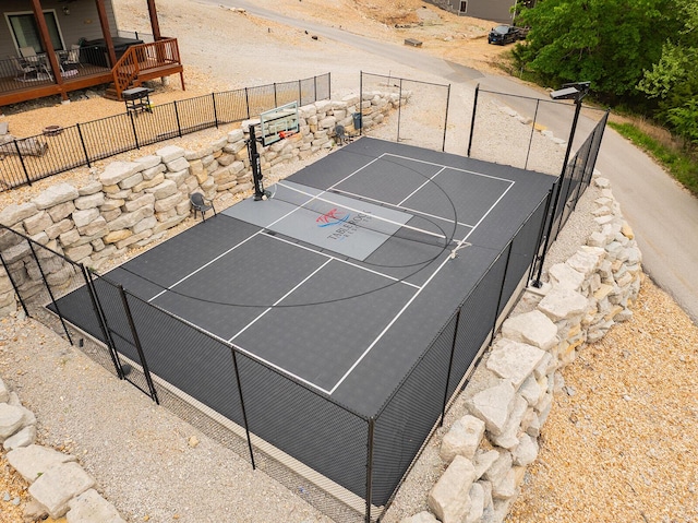 view of sport court with fence