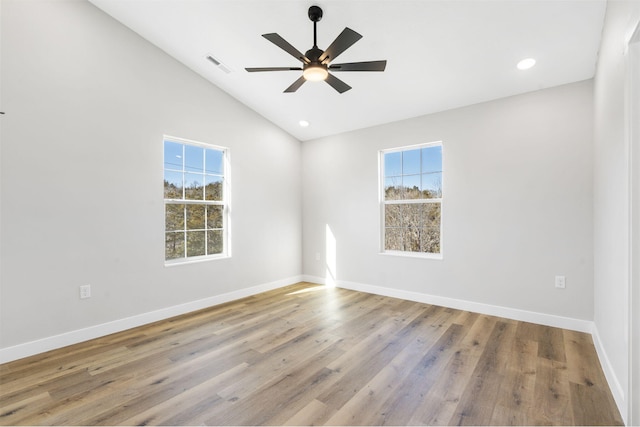spare room with a ceiling fan, baseboards, recessed lighting, wood finished floors, and visible vents