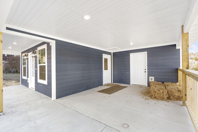 property entrance featuring a patio area