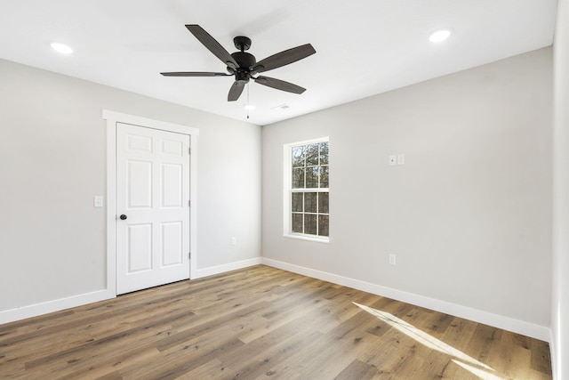 unfurnished bedroom with baseboards, ceiling fan, recessed lighting, and wood finished floors