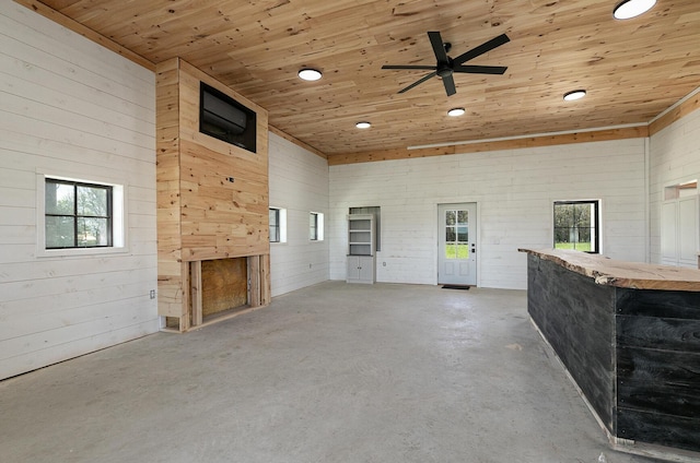 2107 E 530th Rd, Pleasant Hope, MO 65725 - unfurnished living room with wooden ceiling, recessed lighting, unfinished concrete flooring, and a healthy amount of sunlight