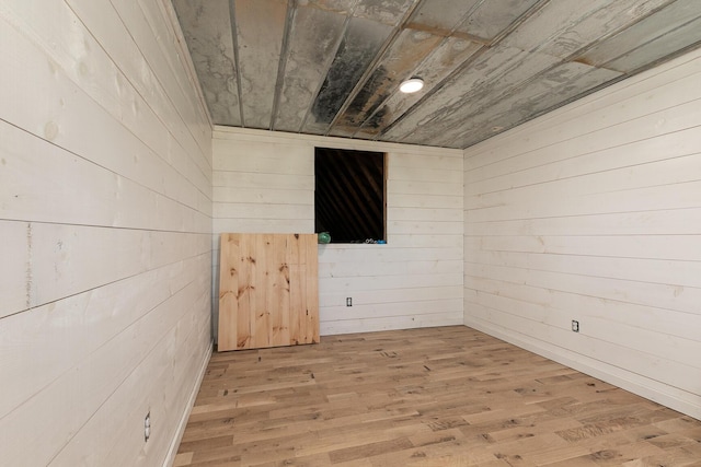2107 E 530th Rd, Pleasant Hope, MO 65725 - unfurnished room featuring light wood-type flooring, wood ceiling, and wooden walls