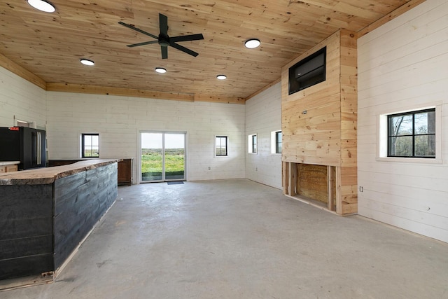 2107 E 530th Rd, Pleasant Hope, MO 65725 - unfurnished living room featuring a healthy amount of sunlight, ceiling fan, recessed lighting, wooden ceiling, and concrete floors