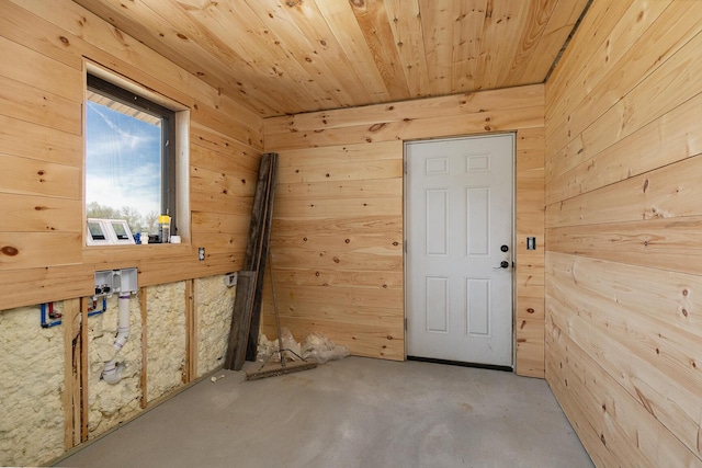 2107 E 530th Rd, Pleasant Hope, MO 65725 - spare room with wooden walls, concrete flooring, and wooden ceiling
