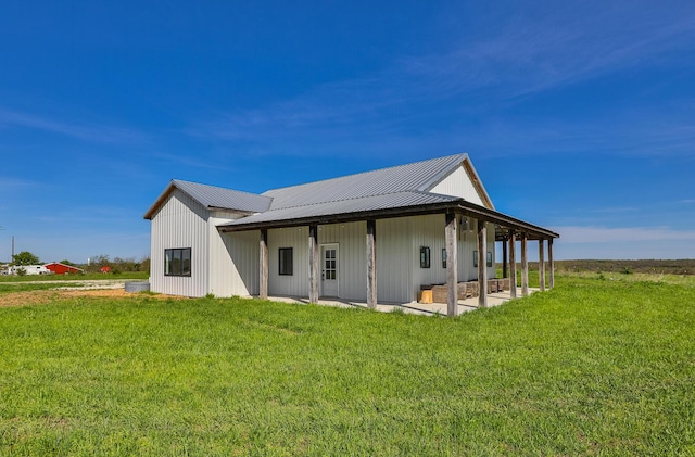 2107 E 530th Rd, Pleasant Hope, MO 65725 - back of property featuring a yard, a patio area, and metal roof